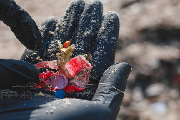 istock Close up shot of hand picking up microplastic, showing it on hand 1906564006
