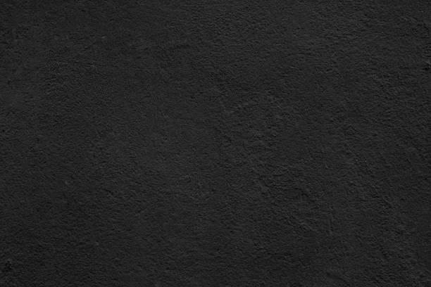 istock Texture of rough black plaster. 1906565090