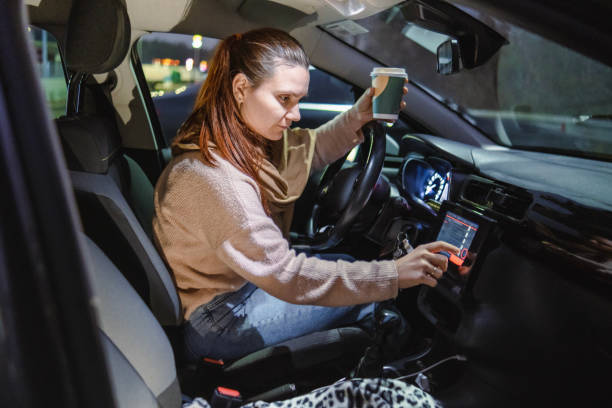 istock Connecting my phone to car by Bluetooth before driving off to work 1906580874