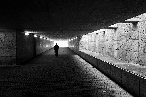 Convergent perspective, lights and shadows inside a tunnel.