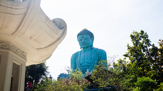 The Great Buddha (Daibutsu) stucco buddha, The mock-up Daibutsu Buddha statue at the Wat Doi Phra Chan Buddhist temple of Mae Tha in Lampang Province, North of Thailand.