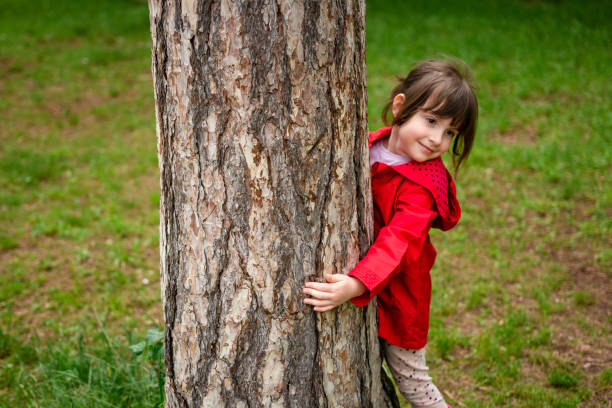 istock Little girl playing in the park during spring day. 1906620229