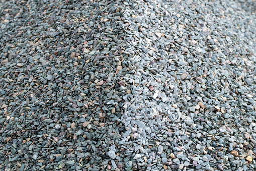 Two toned grey aggregate, pile of stone chippings, dark grey gray and light grey Gary, contrast
