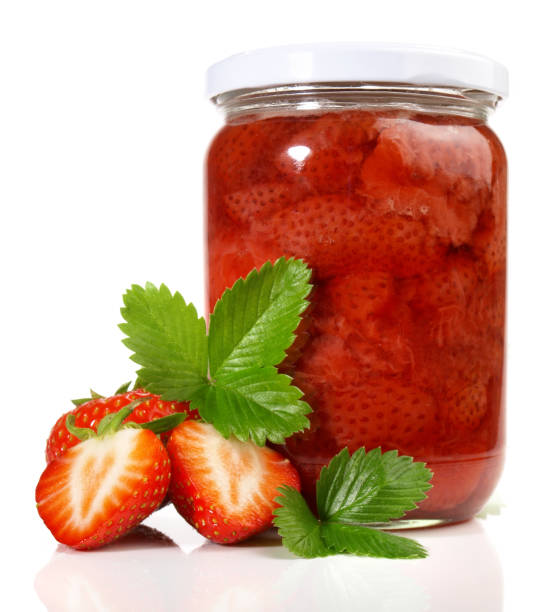 istock Strawberry Jam in a Glass isolated on white Background 1906688441