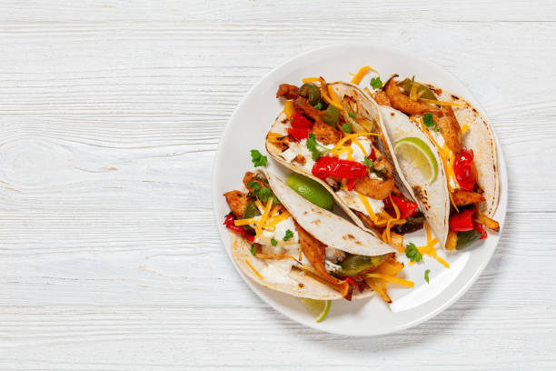 istock baked tex-mex chicken fajitas on a plate, top view 1906697997