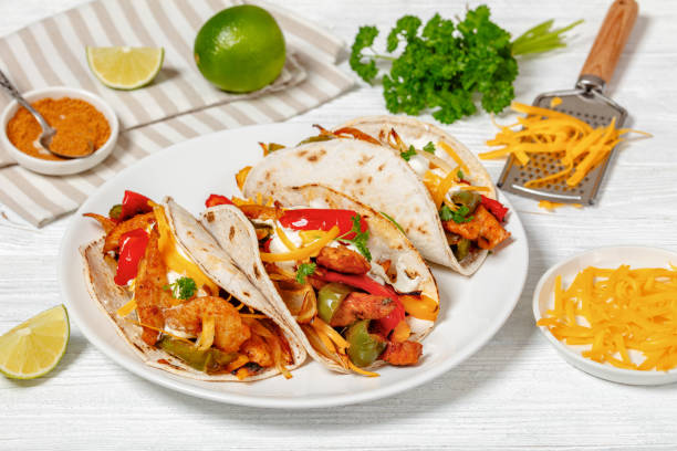 istock baked tex-mex chicken fajitas on a plate, top view 1906698009