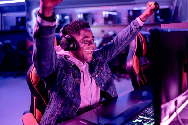 istock Black gamer's jubilant victory in eSports 1906710061