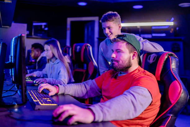 istock Four friends unite in virtual gaming battle 1906711648