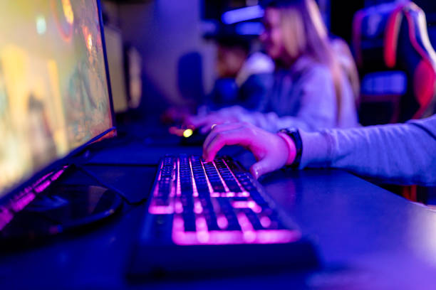 istock Focused fingers fly over gaming keys in eSports challenge 1906714770