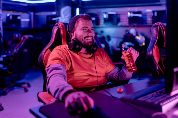 istock Gamer's refreshing break during intense eSports match 1906724778