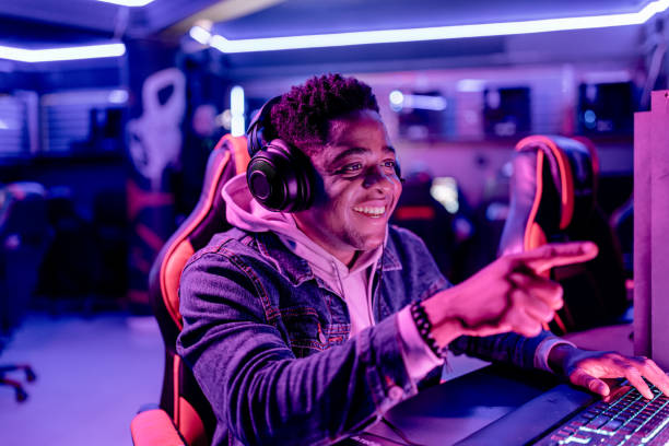 istock Focused eSports gamer points to success 1906726328