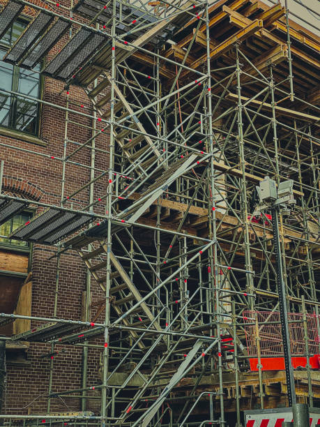istock Scaffolding and scaffolding on a construction site - vintage effect 1906738550