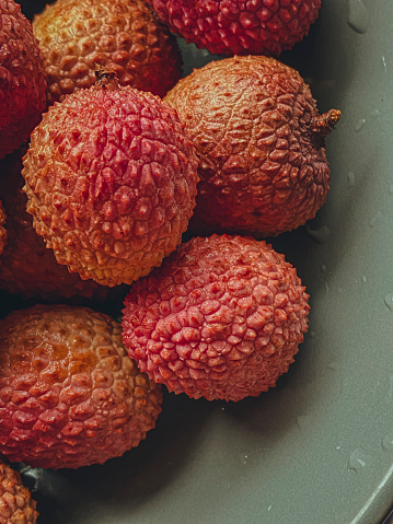Ripe lychees on a plate, close-up.