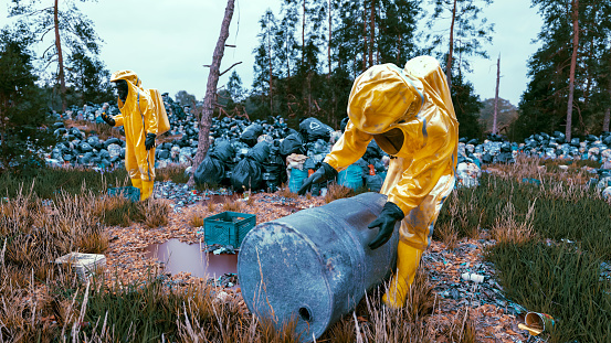 People  in hazmat suits working in an area littered with trash. The environment appears to be outdoors, possibly a dumpsite or a contaminated area, due to the large number of garbage bags and scattered waste. Concept of destroying planet Earth.