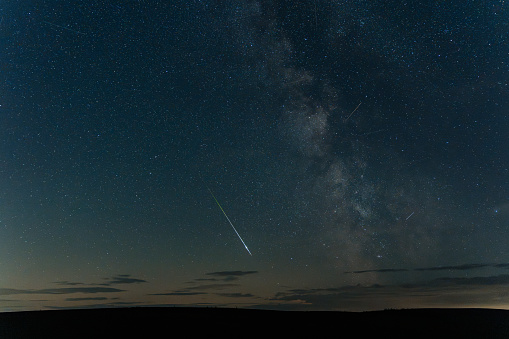 A Perseid Meteor across the night sky alongside the Milky Way core from Northumberland
