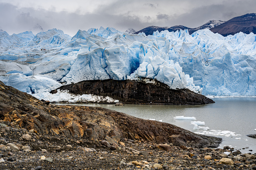 A scenic view of Perito Moreno Glacier on a cloudy day in Patagonia, Argentina