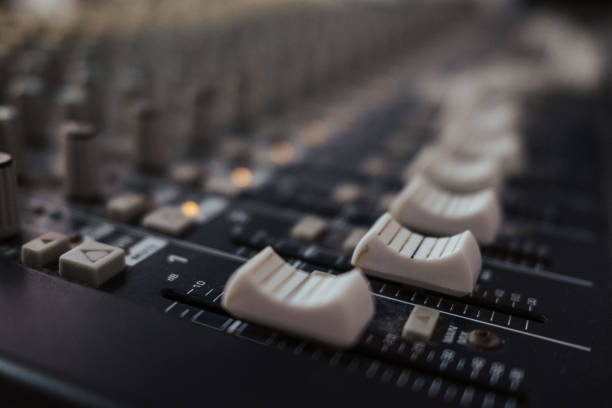 istock Closeup of an analog audio mixer in a studio 1906769706