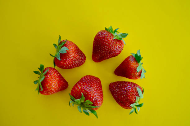 istock Fresh strawberries displayed against a colorful background 1906769714