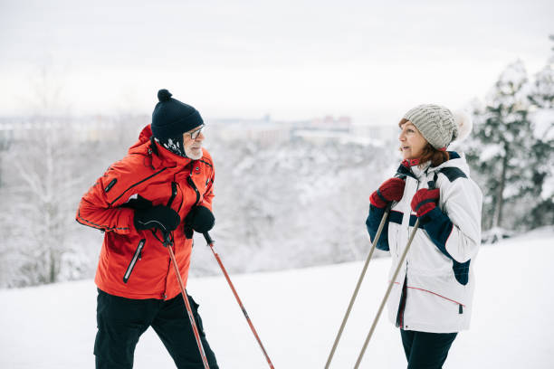 istock Senior couple rests on their ski poles 1906791163