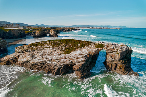 Above view to the empty Praia das Catedrais or Beach of Cathedrals located on northwest coast of Spain. It has been declared Natural Monument. Travel and famous touristic places concept. Europe, Spain