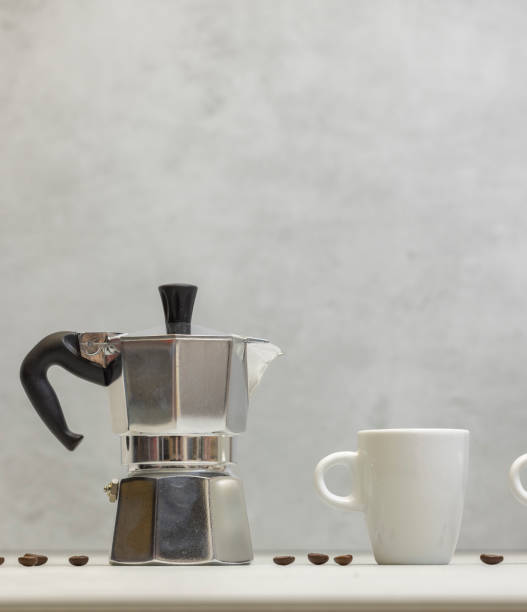 istock Metal geyser coffee maker on table with cup 1906793038