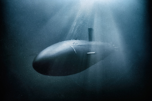 A Los Angeles-class nuclear-powered fast attack submarines (SSN) in service with the United States Navy, seen here diving in a dark ocean setting. Scale model photography.