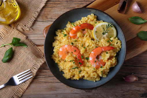 Lemon Rice - South Indian turmeric rice  garnished with nuts curry leaves and lemon juice, selective focus