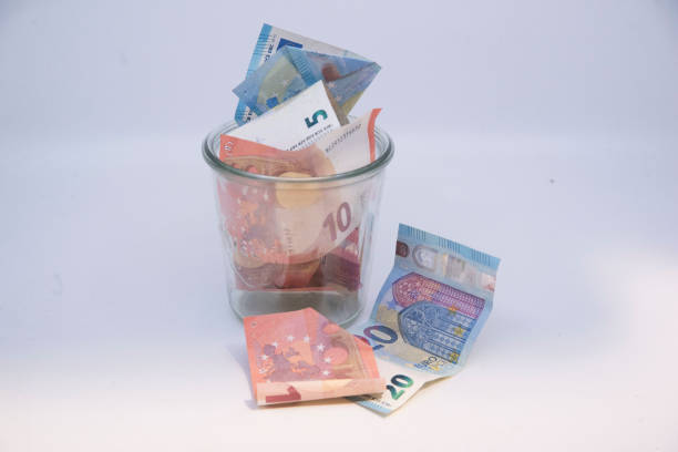 istock euro bank notes, paying in the european union 1906835873