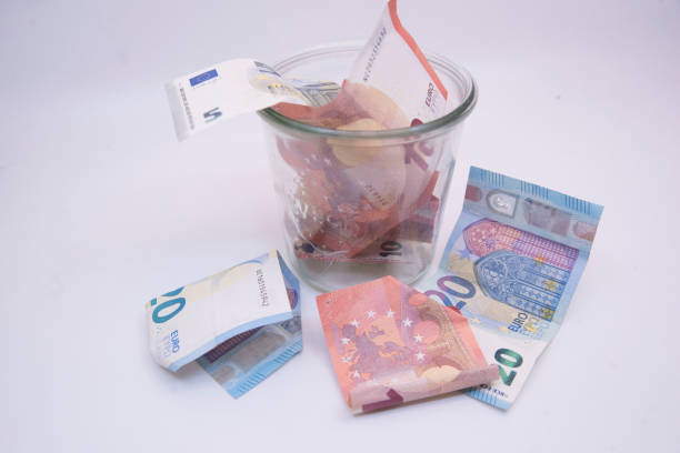 istock euro bank notes, paying in the european union 1906836629