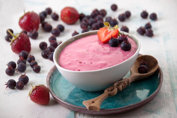 istock Smoothies of strawberries and irgi with yogurt in a ceramic bowl 1906850184