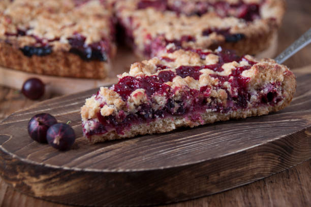 istock Pie with gooseberries on a wooden board 1906857032