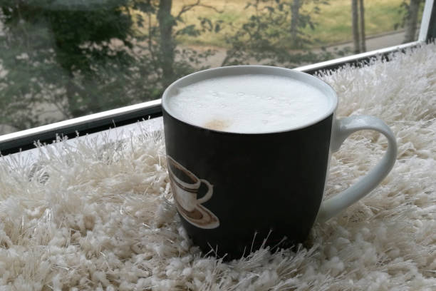Coffee in a black mug stock photo