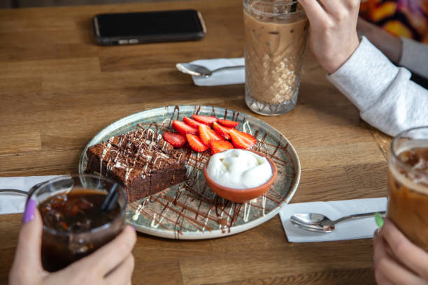 istock People are eating chocolate brownie. 1906886994