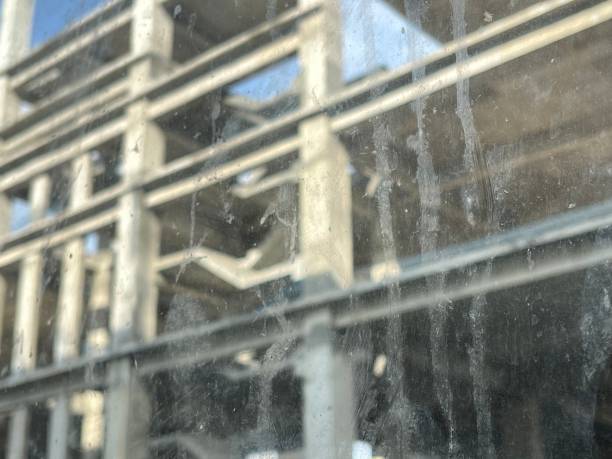 istock Dirty stains on the window glass close up 1906888619