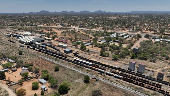 Freeway and cargo train traffic on desert landscape