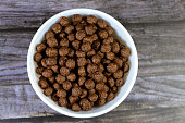 Breakfast Chocolate flavored balls cereal, as a snack prepared with milk for children and adults, crispy crunchy chocolate flavored balls