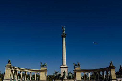 The Heroes Square in Budapest against a bright blue sky
