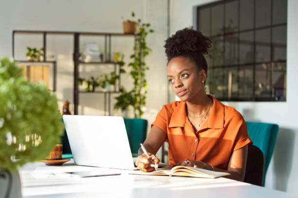 istock Thoughful woman working in an office 1906911831