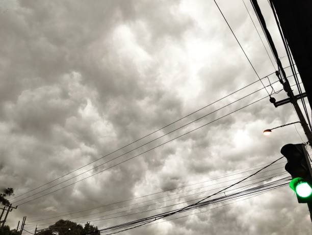 istock cloudy clouds with cable wires and traffic lights 1906915452