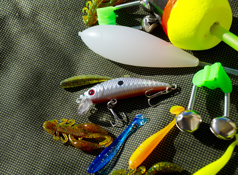 Fishing gear on a tarpaulin background. Background for a fishing theme.