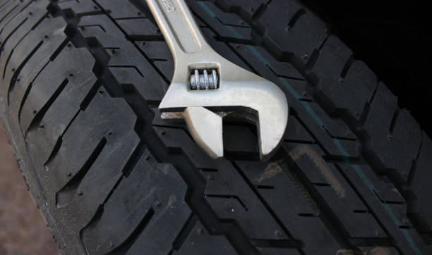 istock 12 Inch Adjustable Spanner On A New Tire Close Up Angle View 1906937312
