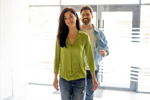 istock Young couple entering clinic together 1906940615