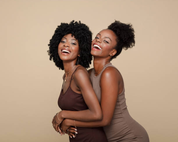 istock Portrait of happy two young women 1906941663