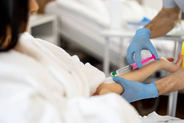 istock Nurse makes an injection through a catheter 1906942227