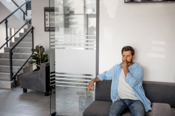 istock Man waiting for a doctors appointment 1906943860