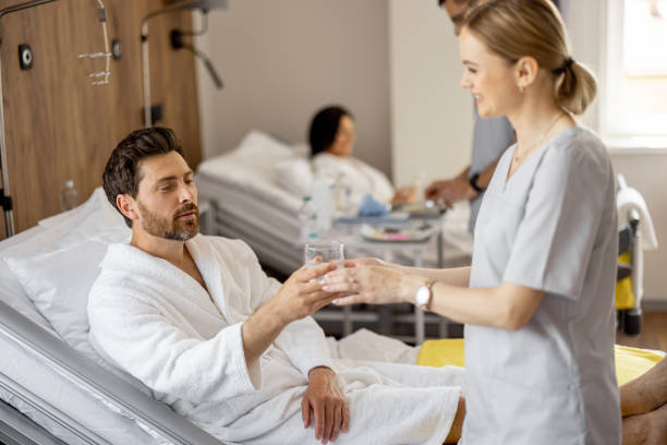 istock Nurse and patient in medical ward 1906944372