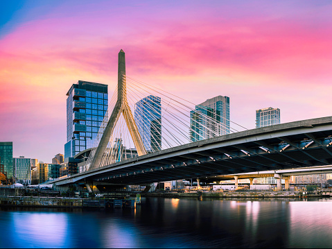 Zakim Bridge and Boston City Skyline over the Charles River at Sunset in Boston, Massachusetts, a beautiful vibrant modern cityscape of New England of America