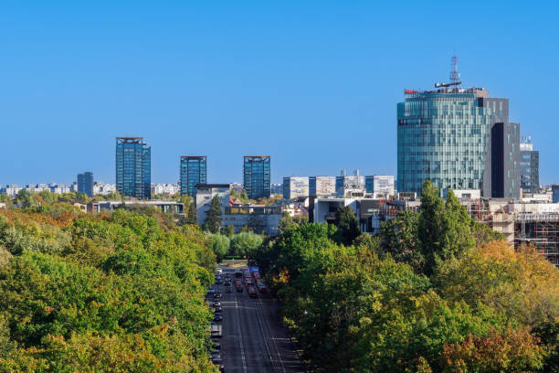 istock Bucharest, Romania panoramic city view from the Triumphal Arch with park and modern buildings in the background under a clear blue sky. 1906967310