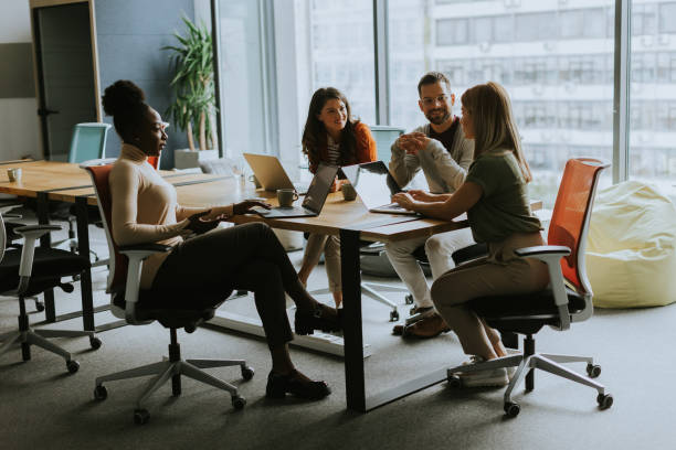 istock Young multiethnic startup team working in the modern office 1906989695