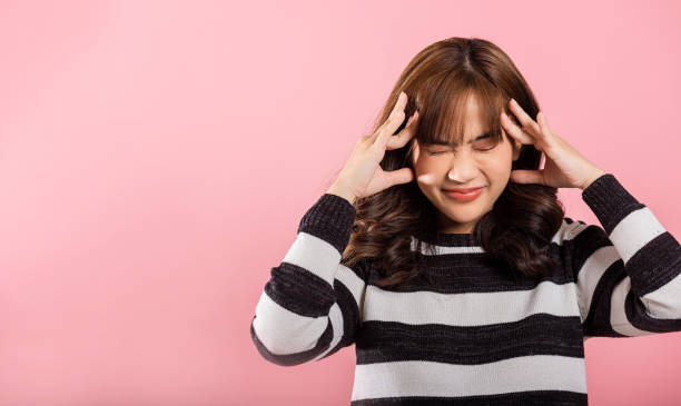 istock stress female person unhappy closed eyes problem she headache 1907002221